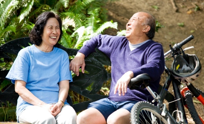 Older couple with dentures laughing