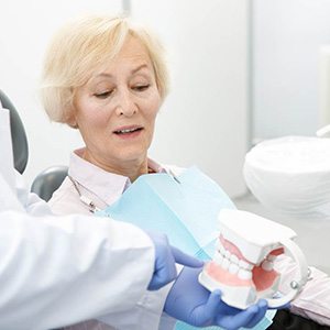 Dentures patient in Fort Worth talking to their dentist