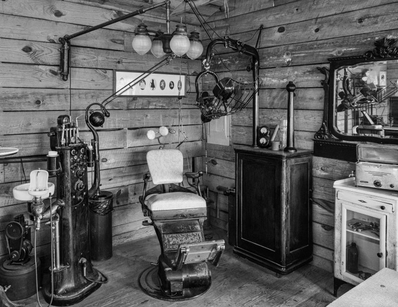 Black and white photo of old dental chair